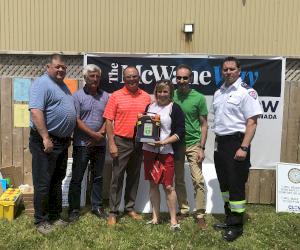 Pictured L-R: Dan Ouellette (EHS Manager), Ken Matthews (Plant Manager), Rick Benoit (General Manager), Eileen, Steve and Andrew